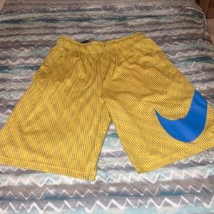 Nike yellow swim trunks